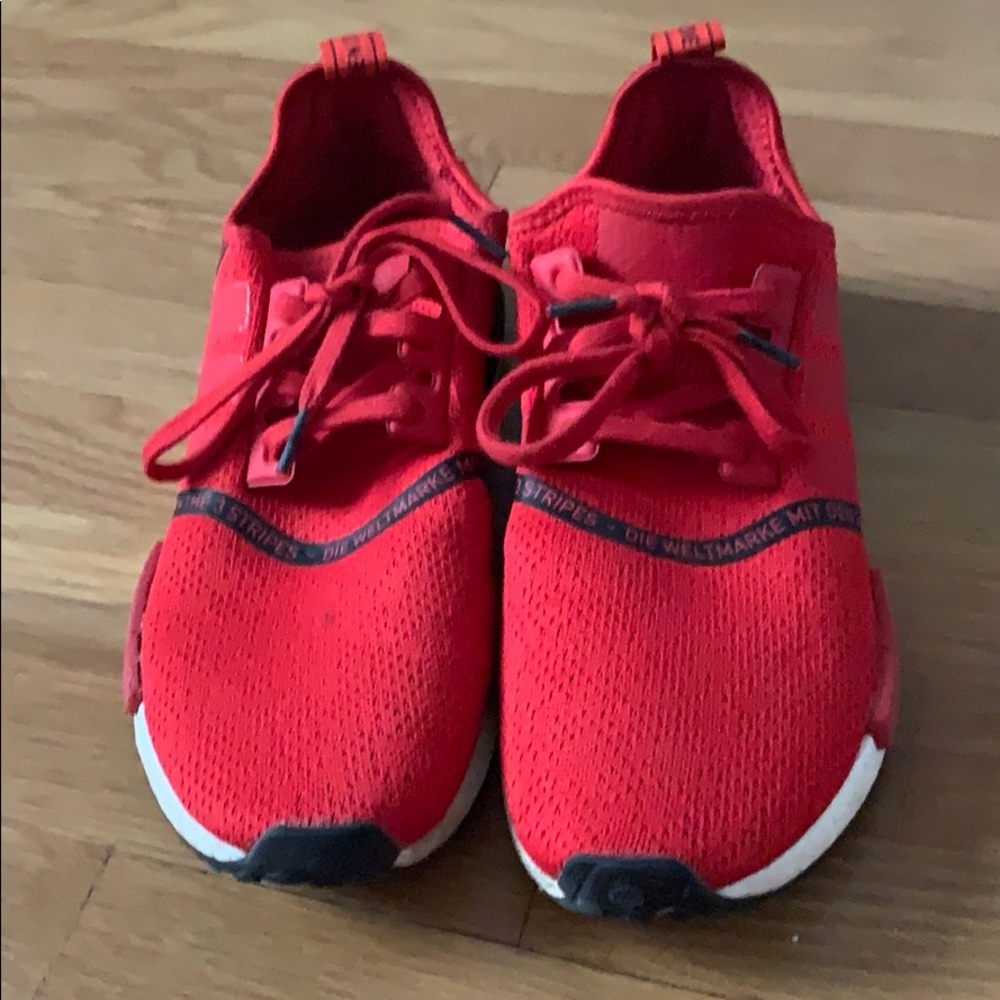 Red and black Adidas NMDs